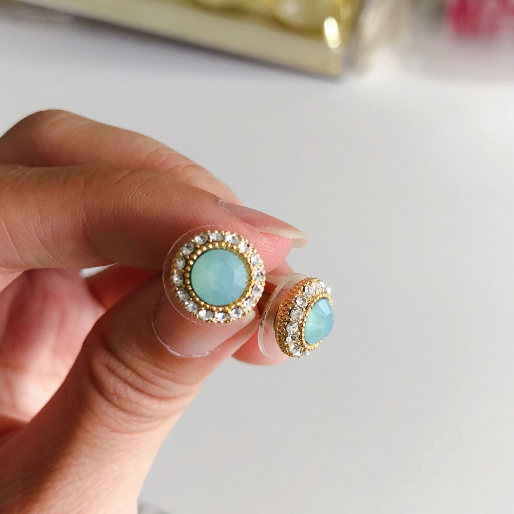 Blue stone wrapped in crystal stud earrings